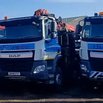 A couple of trucks parked next to each other.
